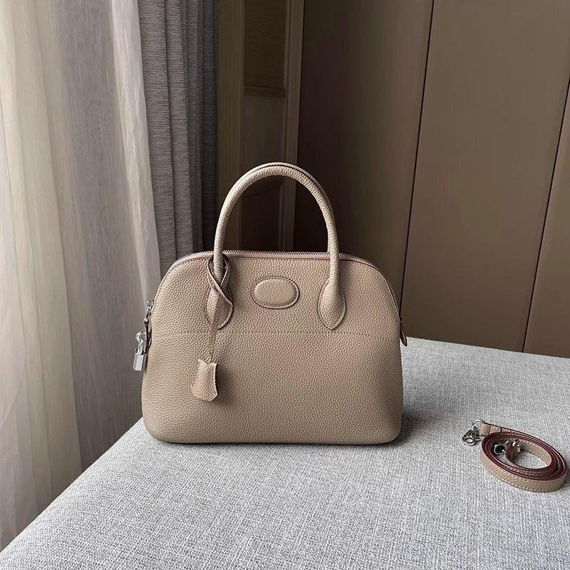 新款荔枝纹真皮贝壳包头层牛皮保龄球手提包拉链大容量通勤女包