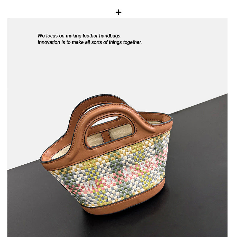 春夏小众沙滩草编拼牛皮波点菜篮子包休闲百搭单肩斜跨手提水桶包