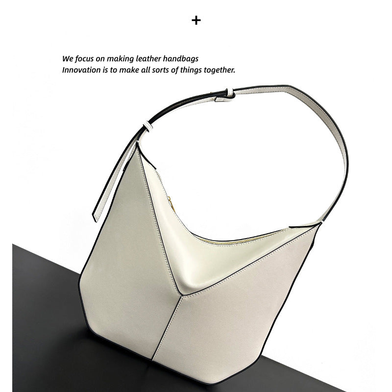 2024新款小牛皮高级感小众设计黑边手提单肩斜挎腋下包真皮吊床包