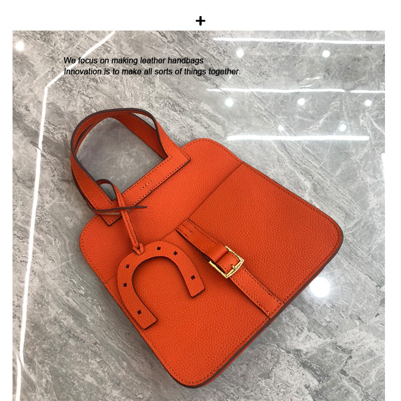 2024新马蹄包时尚单肩斜跨手提荔枝纹头层牛皮休闲真皮女包哈赞包