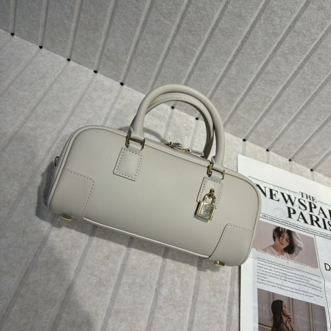 婉云质感真皮2025新款单肩斜挎包迷你复古手提保龄球包小众设计