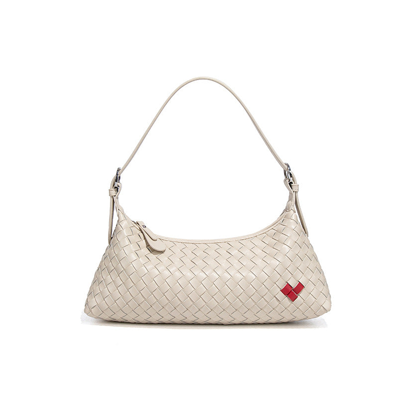 高级感爱心法棍包休闲手提饺子包手工编织女包个性单肩腋下斜跨包