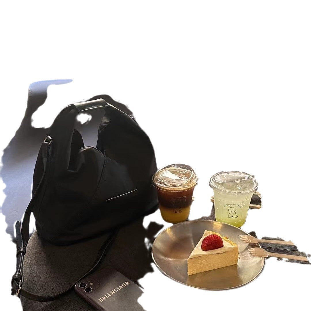 防水牛津布帆布水桶包女高级感小众手提饭盒包真皮斜挎包小托特包