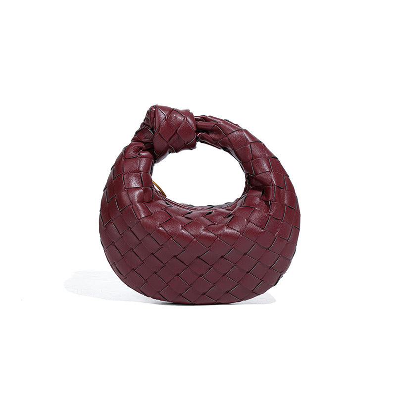 外贸新品时尚手拎饺子包打结手工编织女包百搭mini质感纯色牛角包