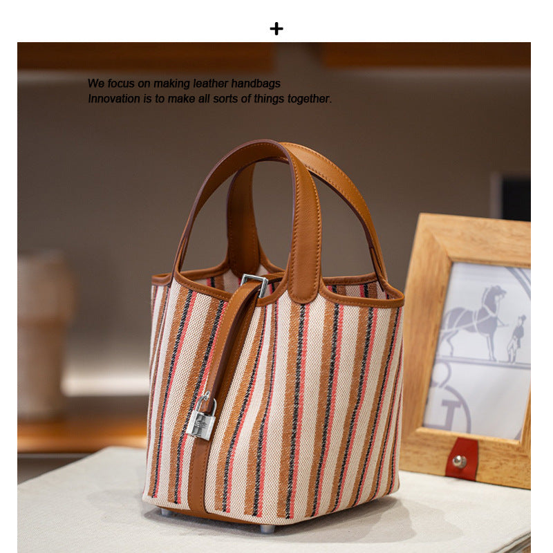 2025夏新款帆布配皮菜篮子大容量手提包通勤百搭真皮女包工厂批发
