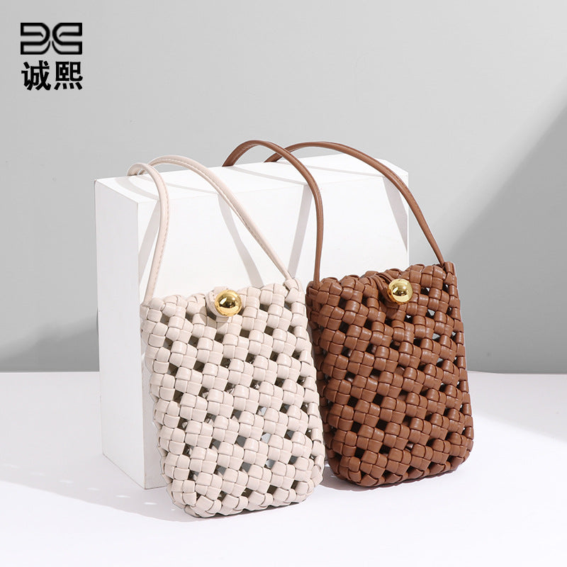 批发2024新款风车结编织竖款斜挎手机包简约mini小众设计单肩女包