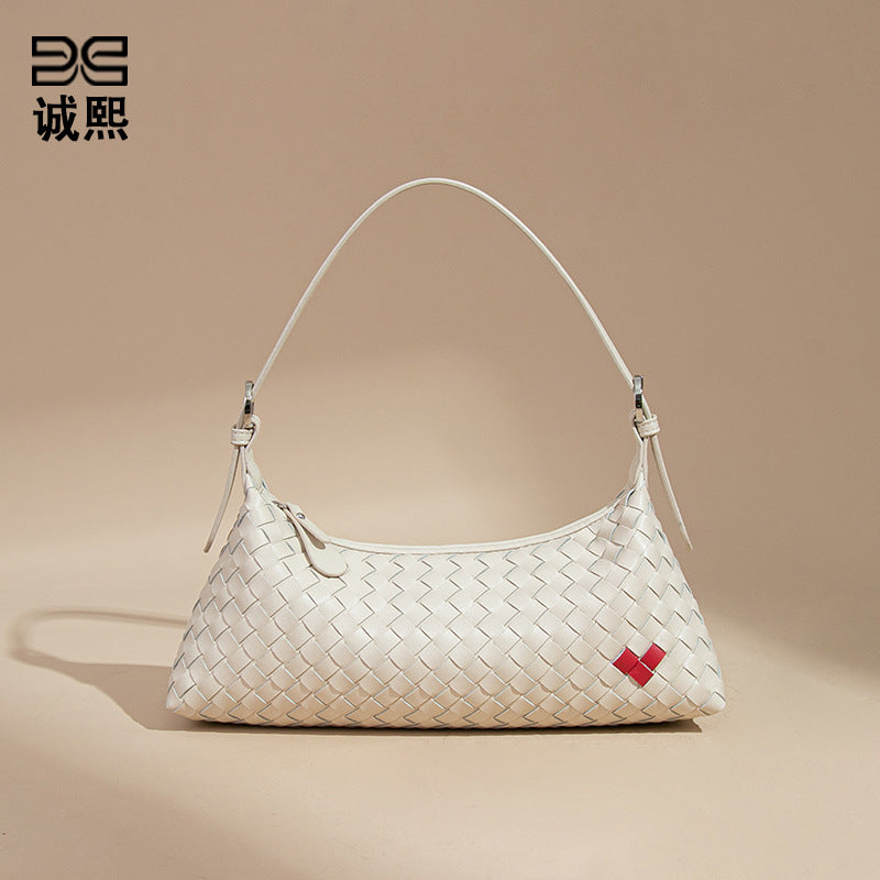 高级感爱心法棍包休闲手提饺子包手工编织女包个性单肩腋下斜跨包