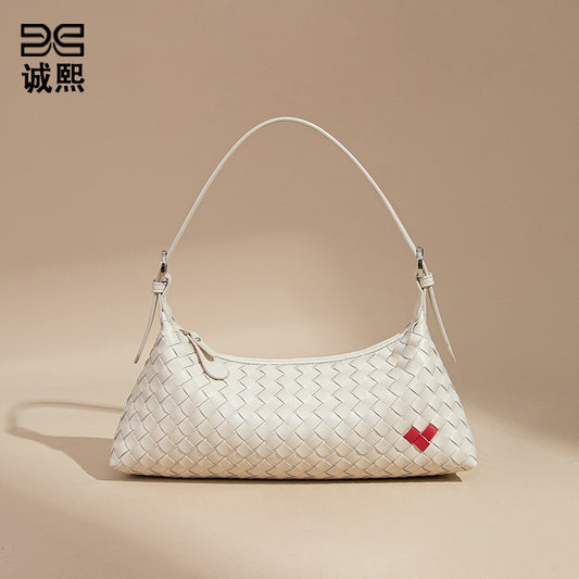 高级感爱心法棍包休闲手提饺子包手工编织女包个性单肩腋下斜跨包