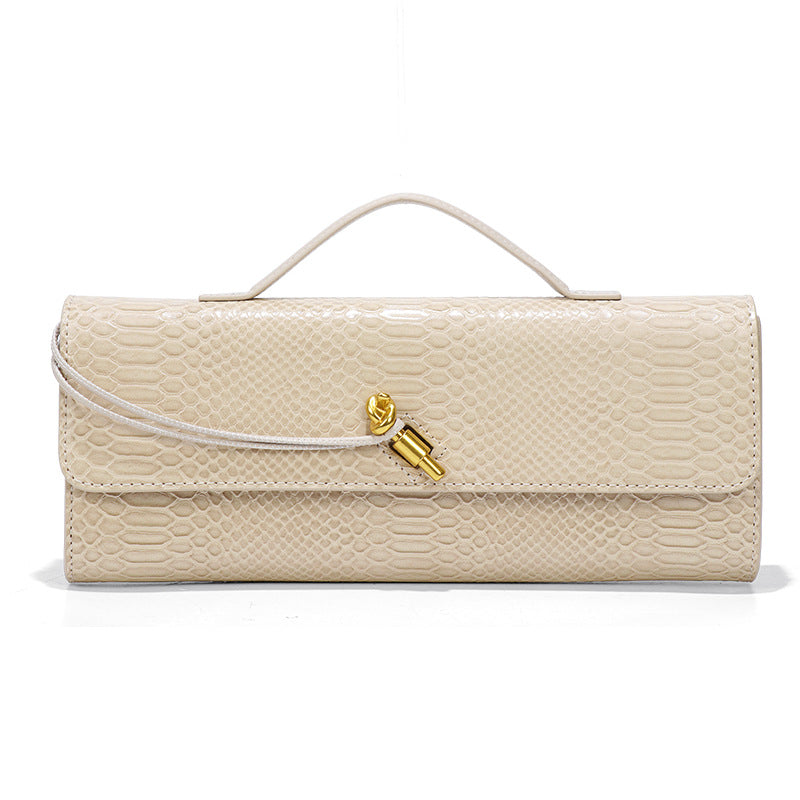 高级感手拿晚宴包包女款横版潮流石头纹法棍包复古小众单肩斜挎包