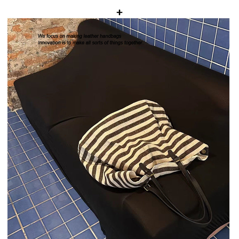 网红同款包包女士2024新款大容量条纹棉麻牛皮单肩托特包手提大包