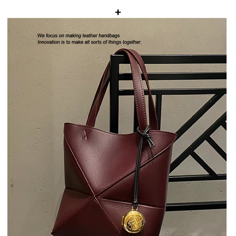 2024新款真皮女包变形几何拼接折叠托特单肩斜跨潮流双肩厂家