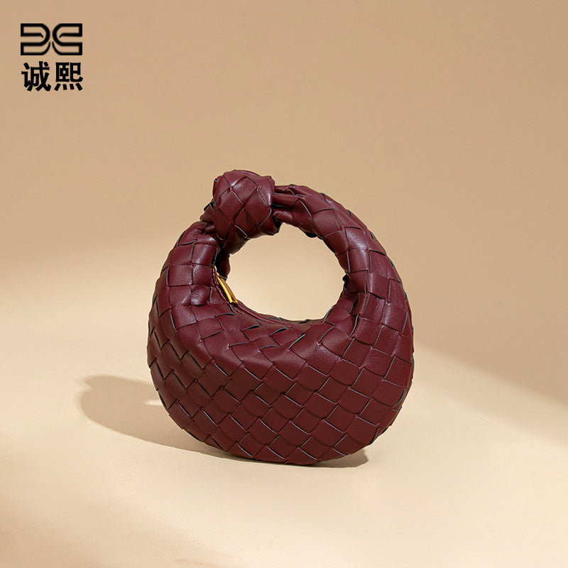 外贸新品时尚手拎饺子包打结手工编织女包百搭mini质感纯色牛角包