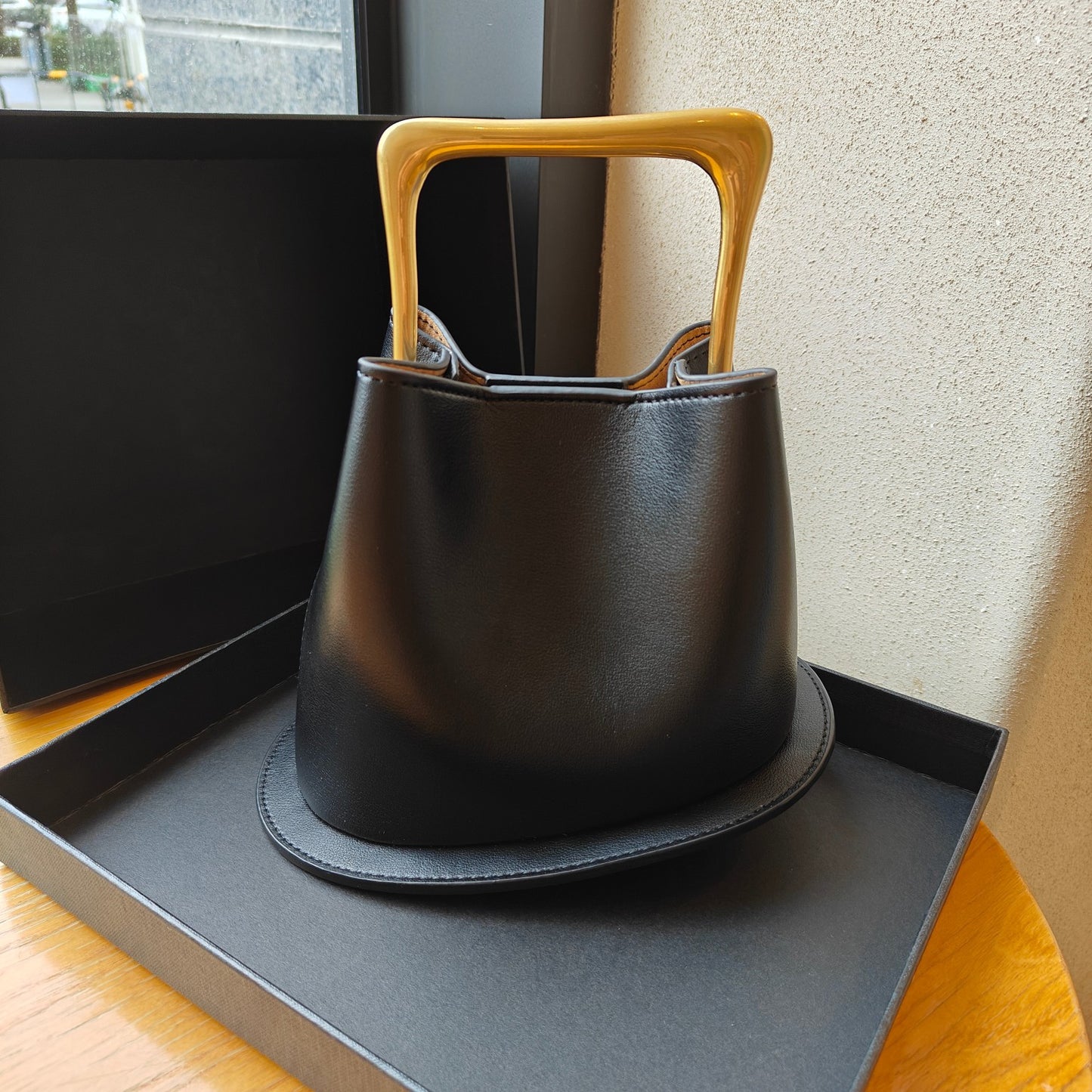 高级质感复古真皮木柄水桶包2024新款不规则小众设计包包休闲百搭