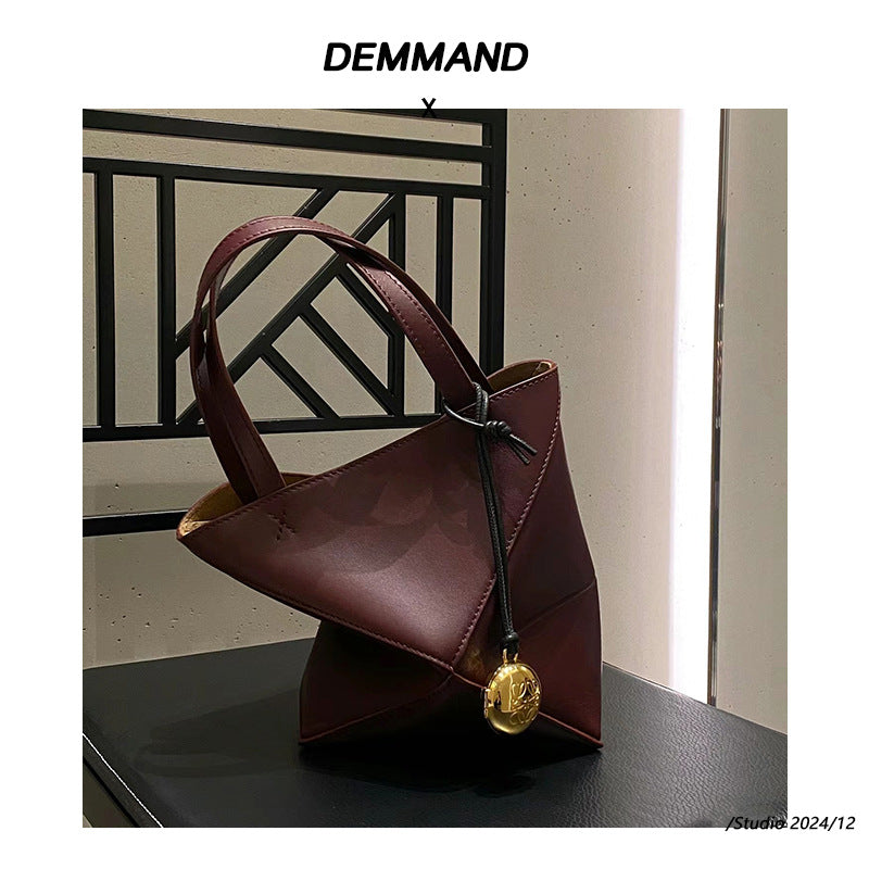 2024新款真皮女包变形几何拼接折叠托特单肩斜跨潮流双肩厂家