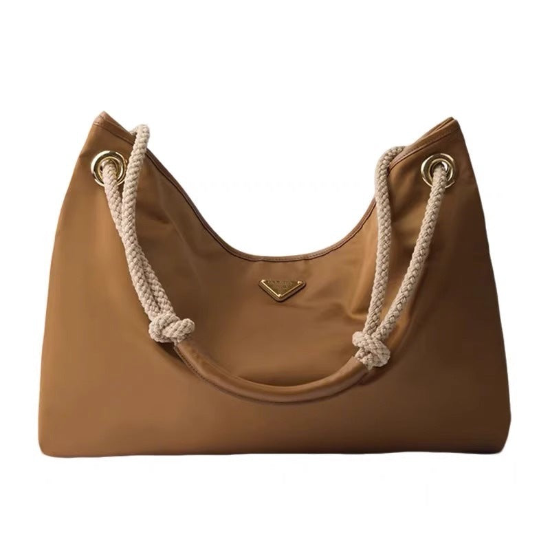 25新款进口防水尼龙抽绳水桶包P家简约时尚大容量手提单肩腋下包