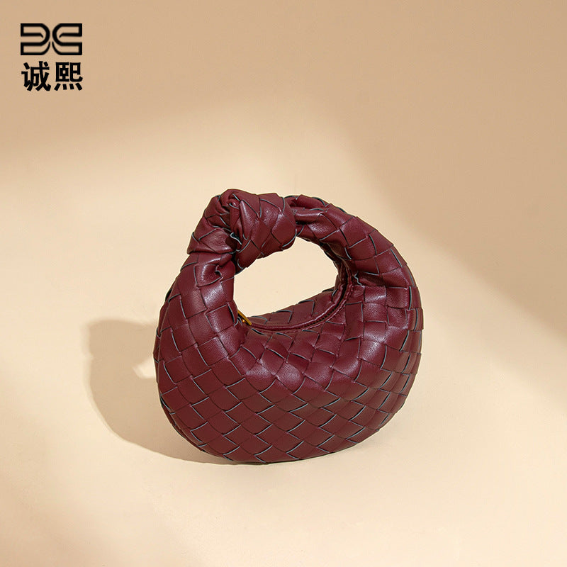 外贸新品时尚手拎饺子包打结手工编织女包百搭mini质感纯色牛角包