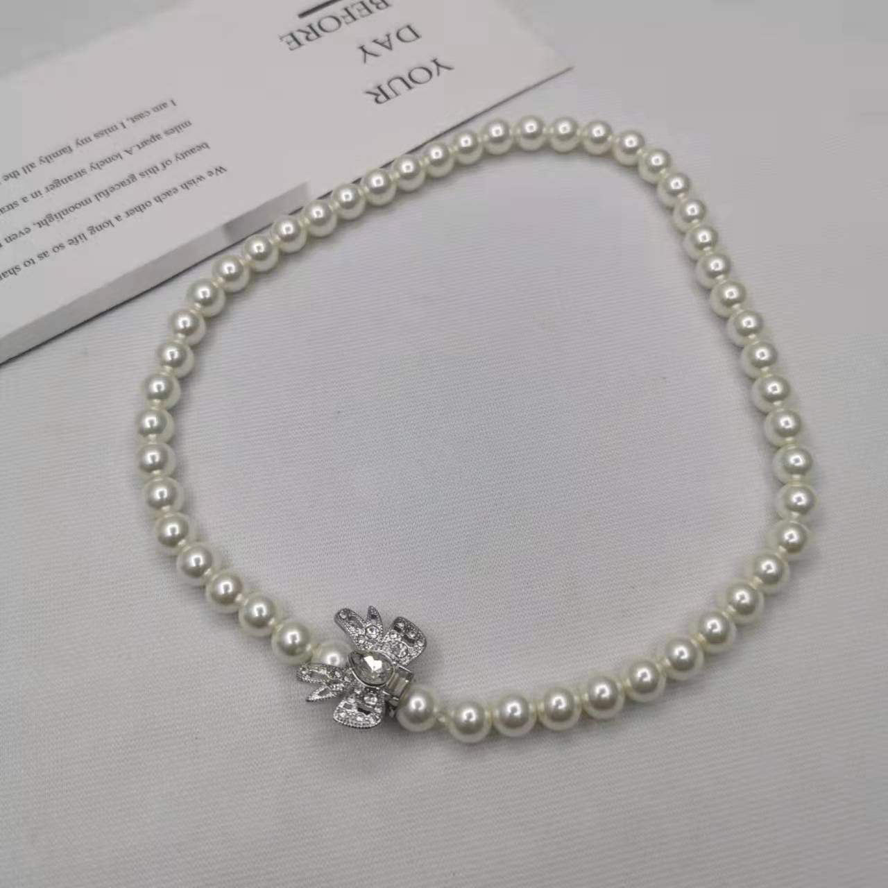 缪家21新款蝴蝶结珍珠项链女手链高级感气质INS风甜美镶钻锁骨链