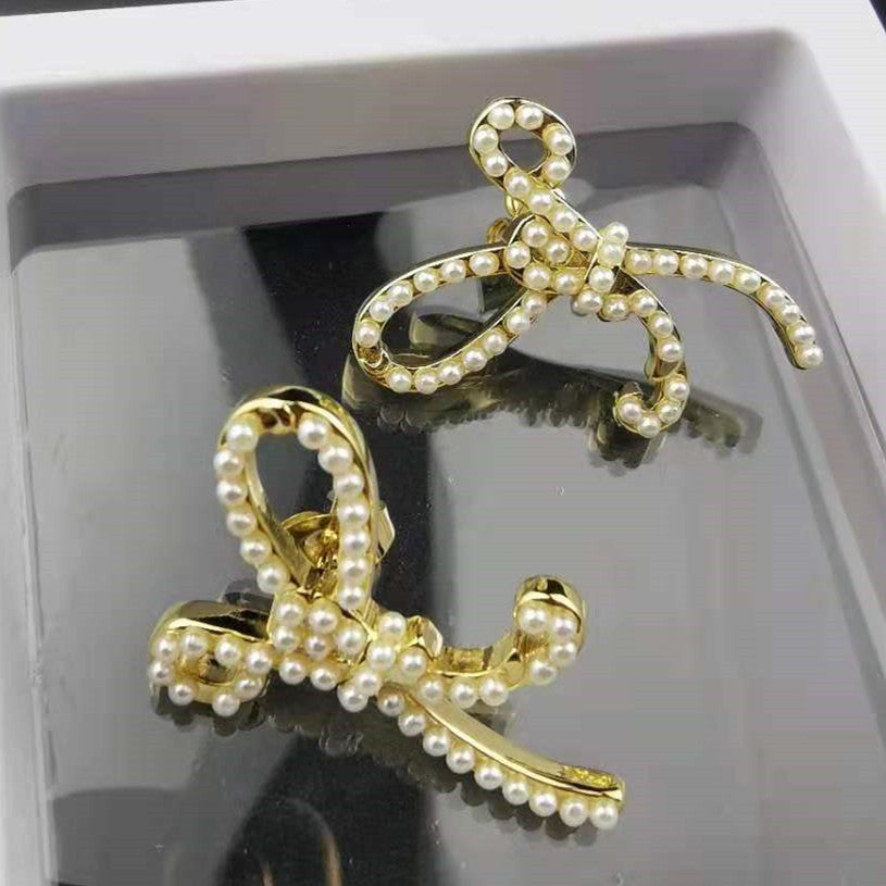 赛家新款耳钉女珍珠蝴蝶结精致INS风法式耳饰不规则蝴蝶结耳钉