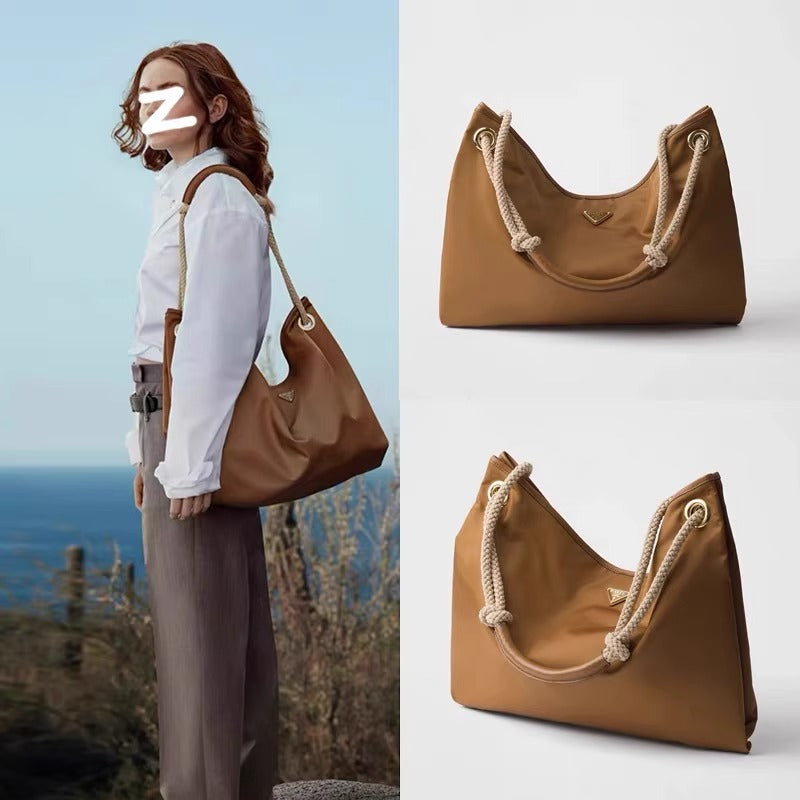 25新款进口防水尼龙抽绳水桶包P家简约时尚大容量手提单肩腋下包