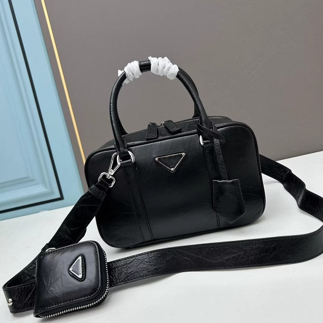 复古手提包包女2025春夏新款百搭保龄球枕头包单肩斜挎包真皮女包