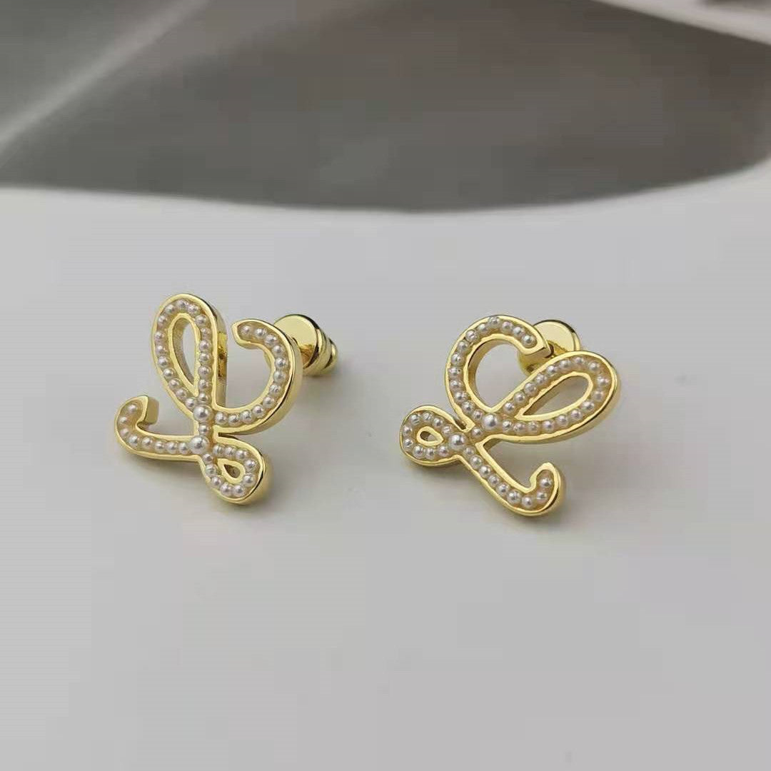 罗家新款几何抽象珍珠耳钉高级感时尚气质厂家批发高版小米珠耳环