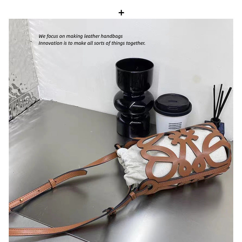 欧货品质女包2023新款水桶包复古文艺牛皮镂空个性单肩斜挎包包