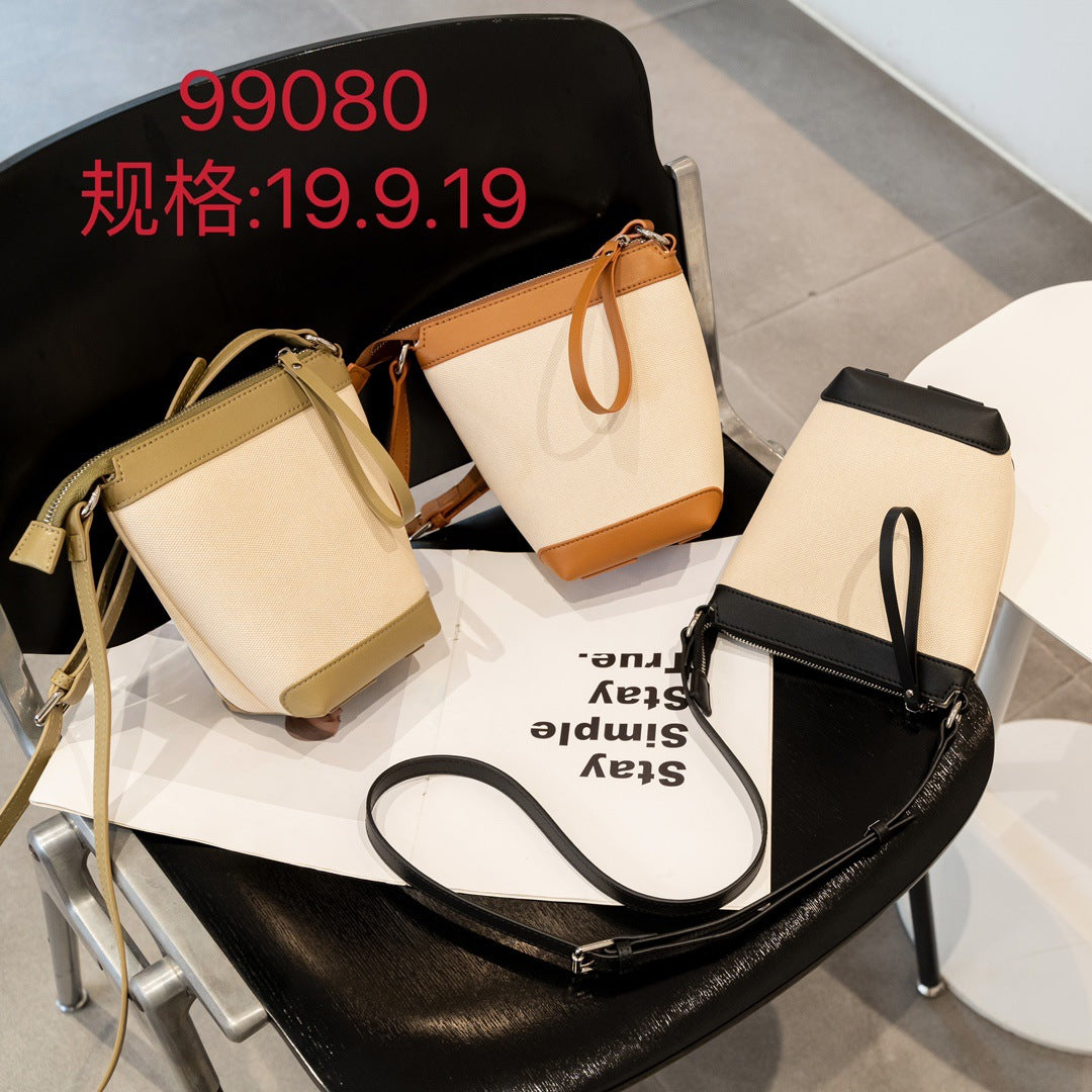 牛皮帆布拼接mini水桶包包女2023夏季单肩斜跨包韩版休闲手机包潮