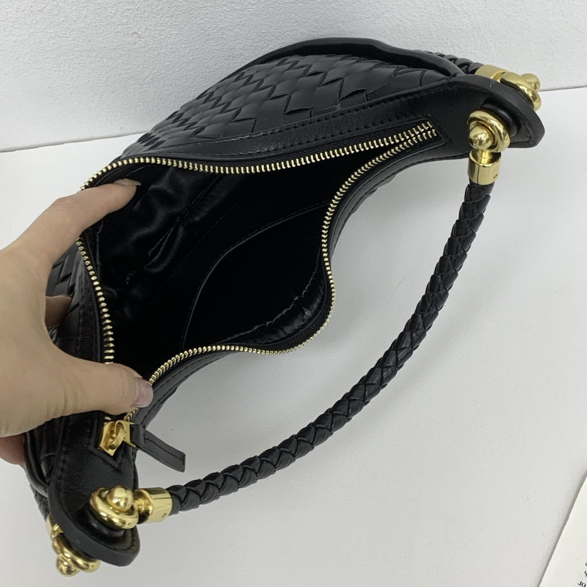 网红爆款编织纹真皮腋下包女百搭2025春季新款牛皮单肩斜跨饺子包