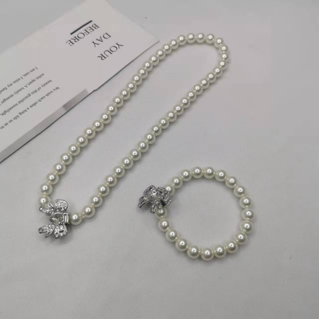 缪家21新款蝴蝶结珍珠项链女手链高级感气质INS风甜美镶钻锁骨链