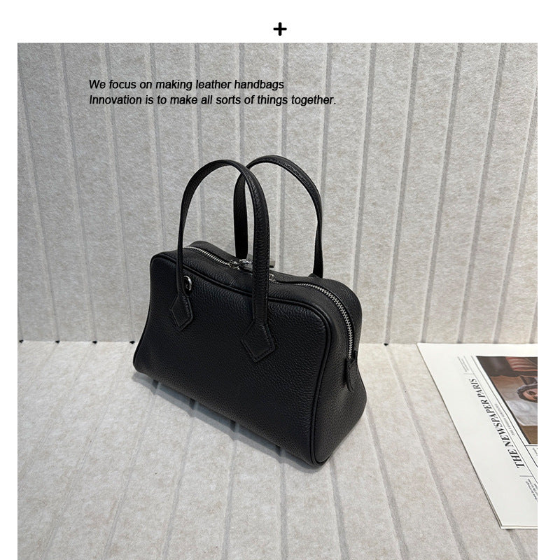 2025新款高端TC皮牛皮维多利亚真皮女包简约保龄球腋下包手提斜挎