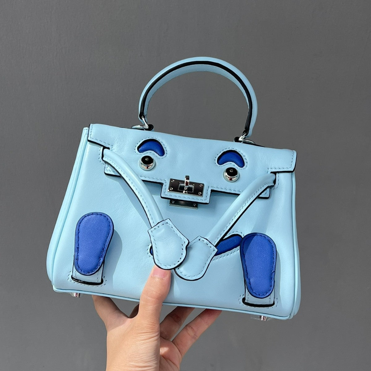 2025春季高级感头层牛皮笑脸包 千禧娃娃迷你凯莉包可爱斜挎包