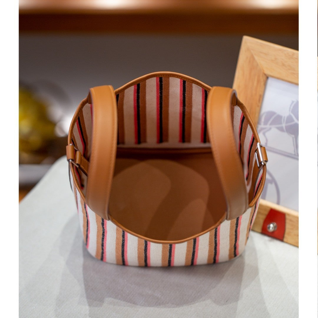 2025夏新款帆布配皮菜篮子大容量手提包通勤百搭真皮女包工厂批发