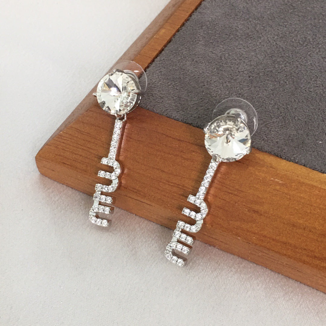 缪加新款MIU字母满钻耳钉女高级感个性气质黄铜K9卫星水钻耳环