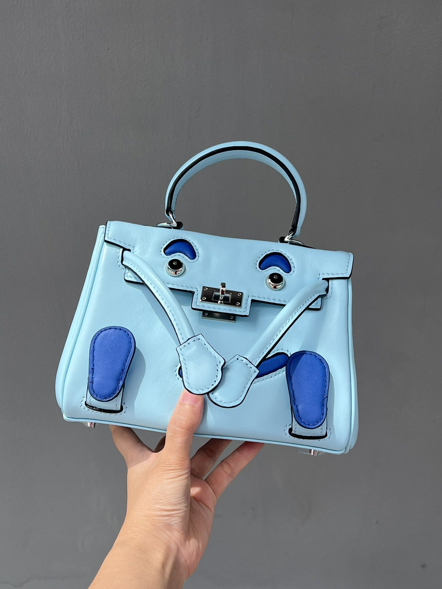 2025春季高级感头层牛皮笑脸包 千禧娃娃迷你凯莉包可爱斜挎包