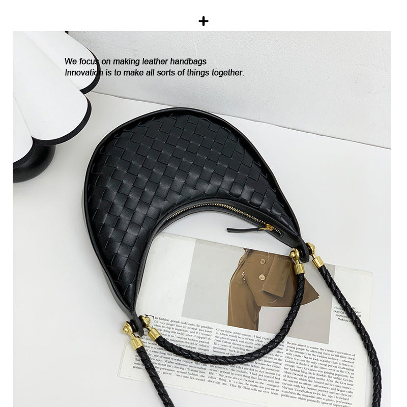 网红爆款编织纹真皮腋下包女百搭2025春季新款牛皮单肩斜跨饺子包