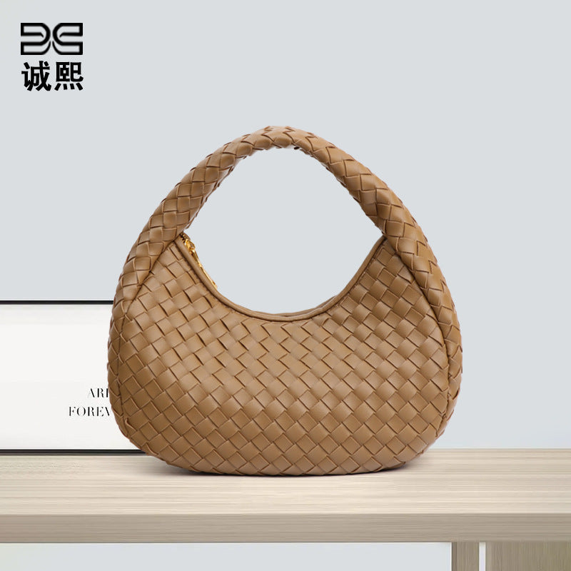 休闲百搭清新手拎月牙包包女网红同款小众简约轻便编织饺子手提包