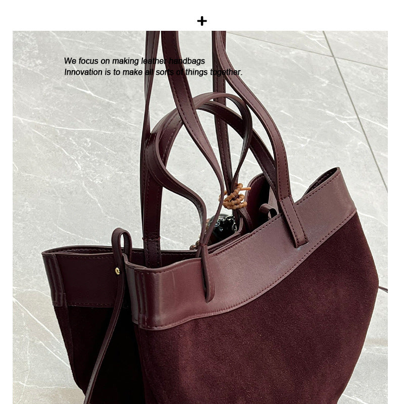 磨砂真皮菜篮子包水桶包包女高级感小众手提包麂皮绒斜挎包锦囊包