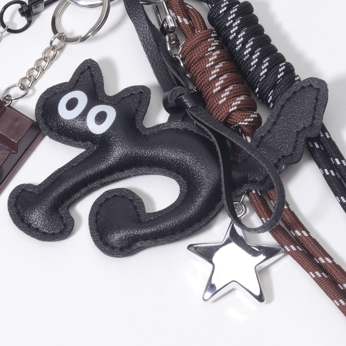 饰品工厂量大价优PU皮质大眼猫巧克力网球拍包包挂件挂饰钥匙扣挂
