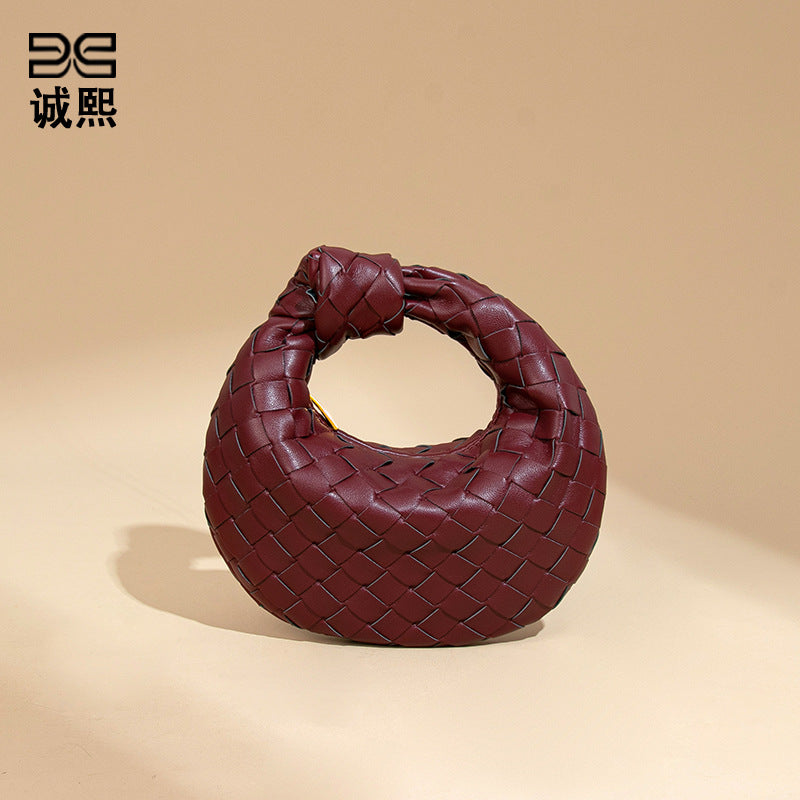 外贸新品时尚手拎饺子包打结手工编织女包百搭mini质感纯色牛角包