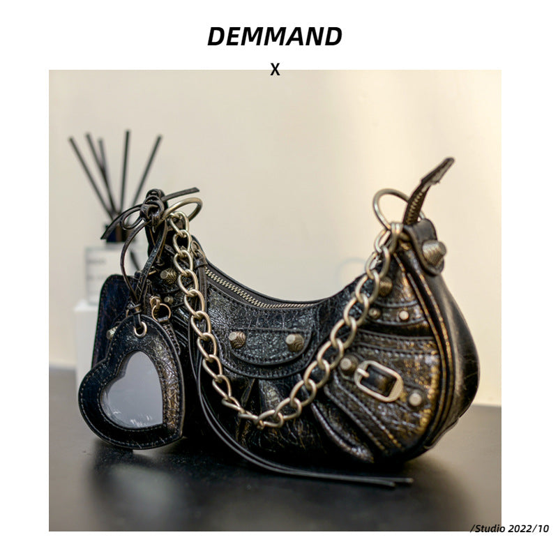 真皮包包女2022新款单肩轻奢月牙包质感法式腋下包铆钉流苏月牙褶