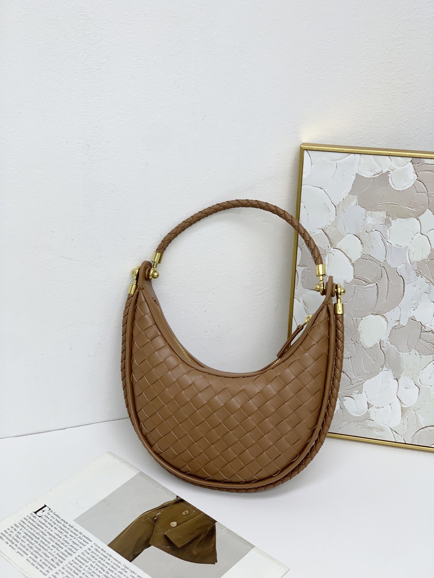 网红爆款编织纹真皮腋下包女百搭2025春季新款牛皮单肩斜跨饺子包