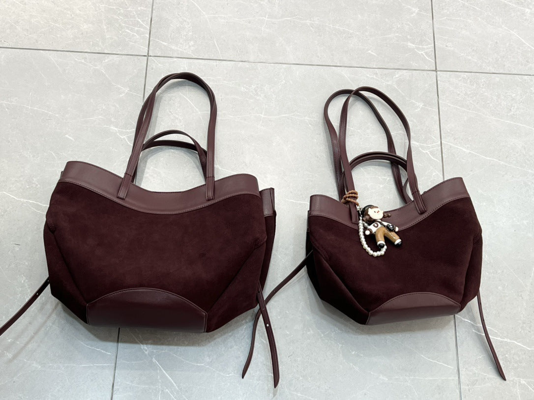 磨砂真皮菜篮子包水桶包包女高级感小众手提包麂皮绒斜挎包锦囊包