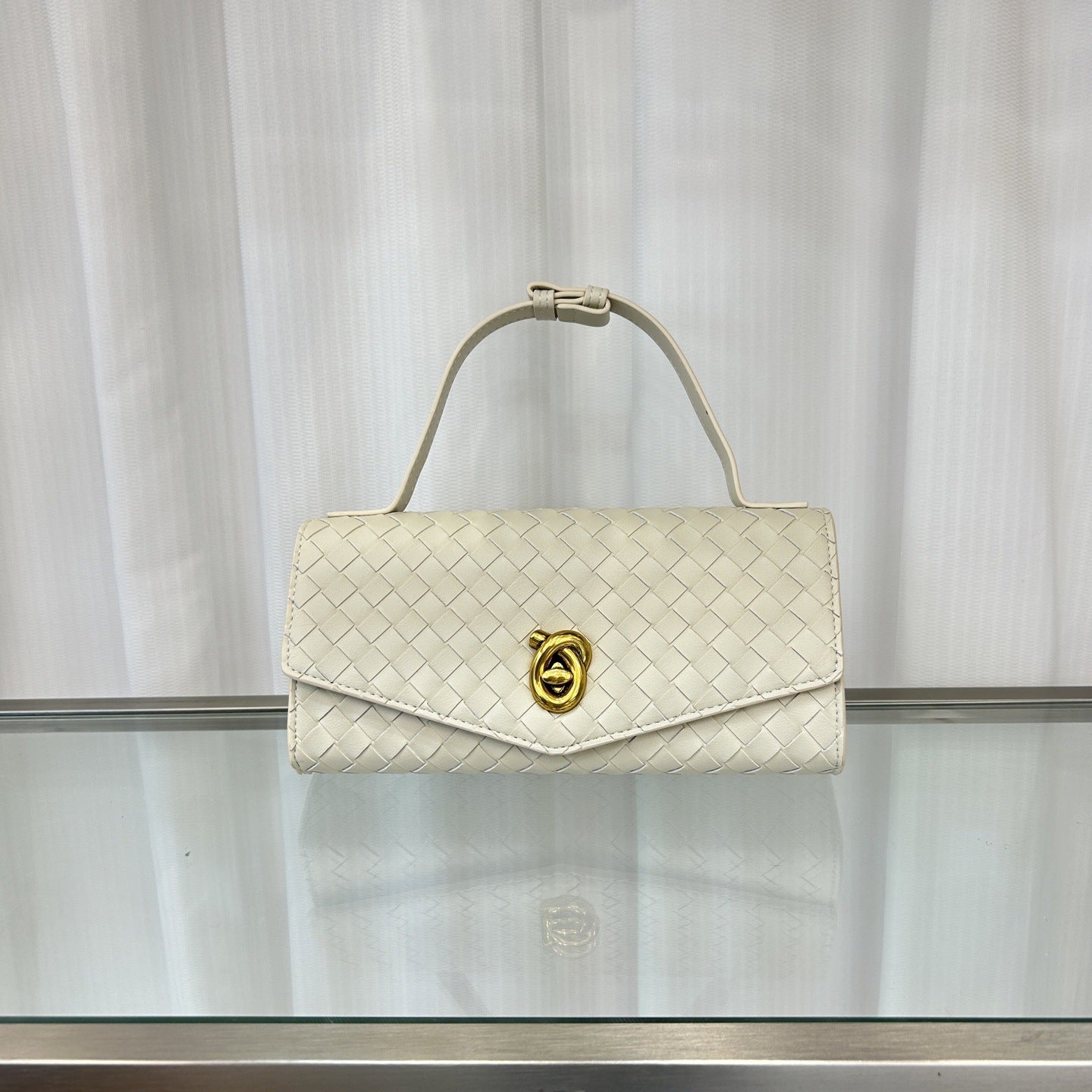 2025春夏新款knotlock牛皮信封包跨境时尚编织包单肩腋下手提包女