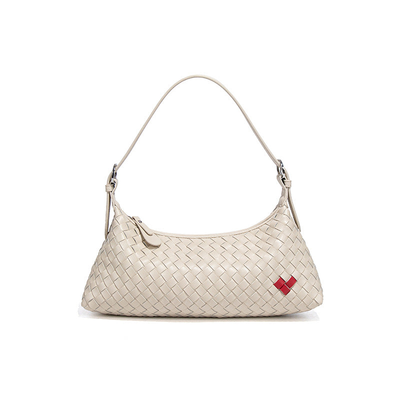 高级感爱心法棍包休闲手提饺子包手工编织女包个性单肩腋下斜跨包