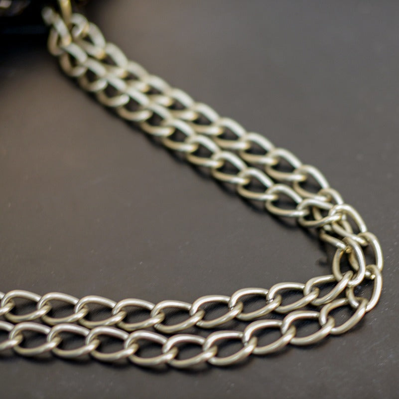 真皮包包女2022新款单肩轻奢月牙包质感法式腋下包铆钉流苏月牙褶