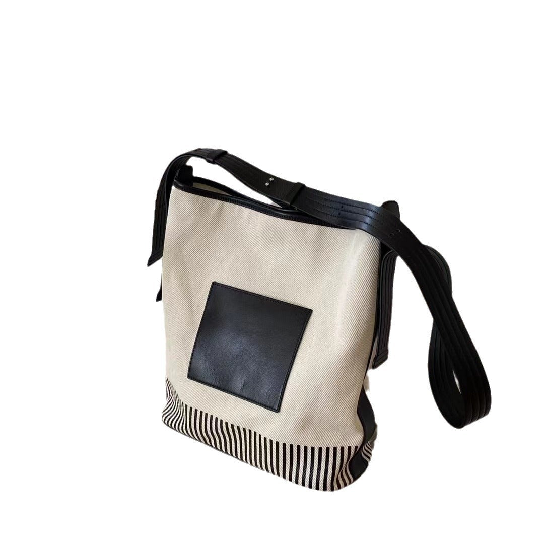 宽肩带水桶包包女士2024新款大容量高级感帆布拼接通勤单肩斜挎包