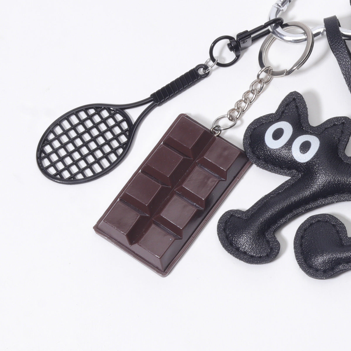 饰品工厂量大价优PU皮质大眼猫巧克力网球拍包包挂件挂饰钥匙扣挂
