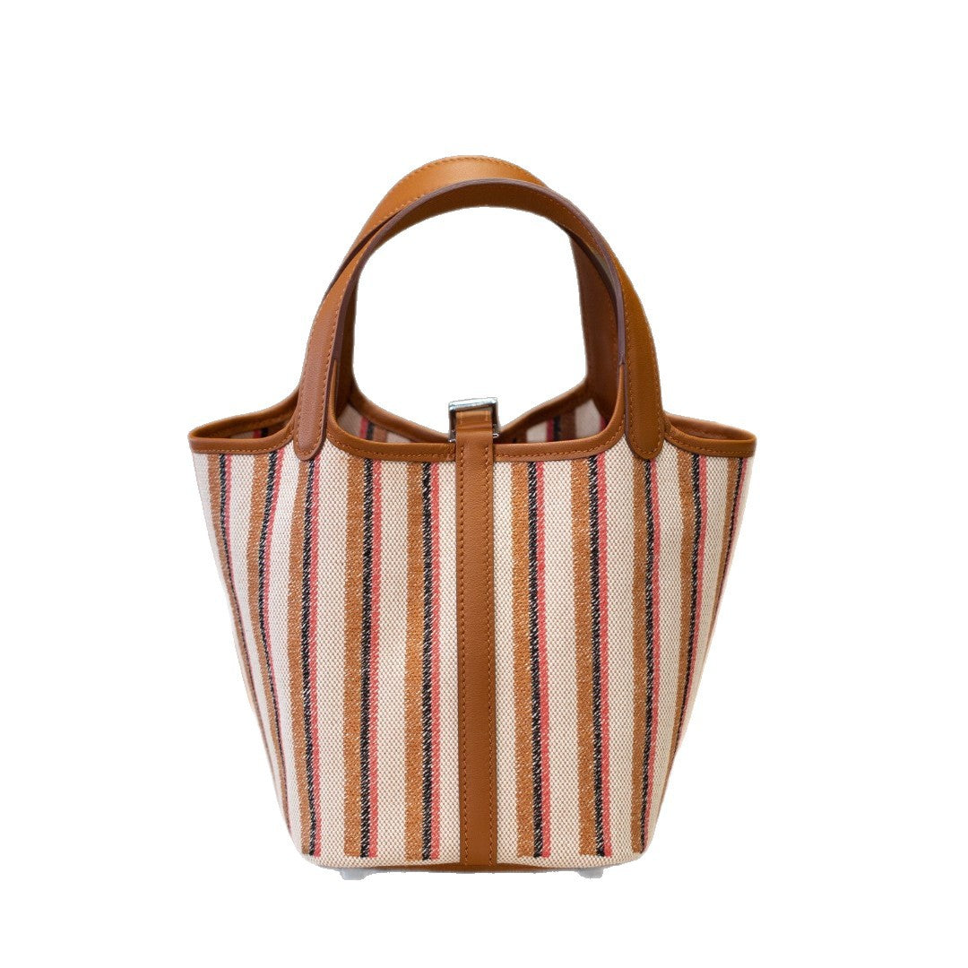 2025夏新款帆布配皮菜篮子大容量手提包通勤百搭真皮女包工厂批发