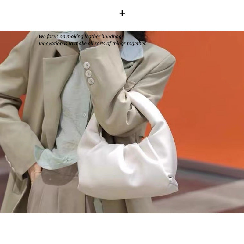 包包女2022新款女包牛角包pouch云朵包饺子包手提单肩包真皮女包