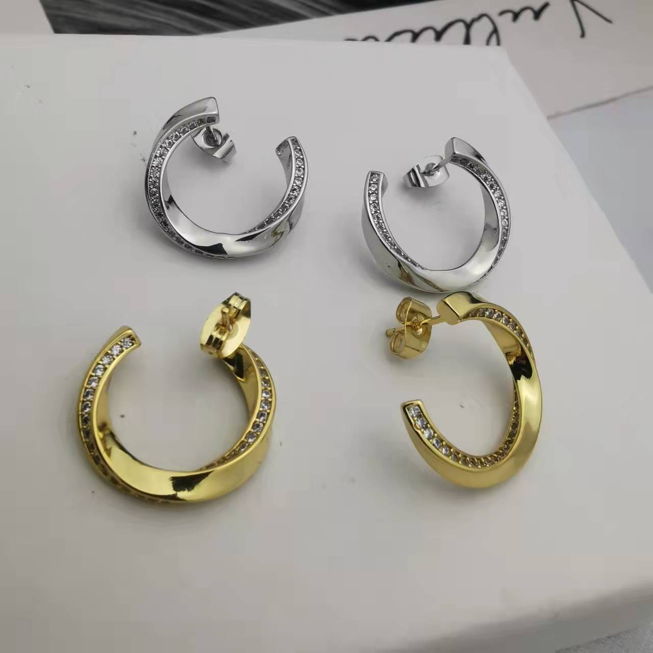 赛家21新款扭曲耳钉女镶钻高级感气质几何形celi镀金环形曲面耳环